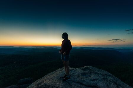 Hiker woman standing on the topの写真素材