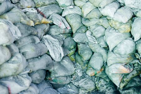 Warehouse bags full of cement and building sandの写真素材