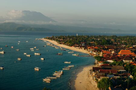 Panoramic view of the northern coast of the island of Lembongan and Jungutbatu village. Gungung Agungの写真素材