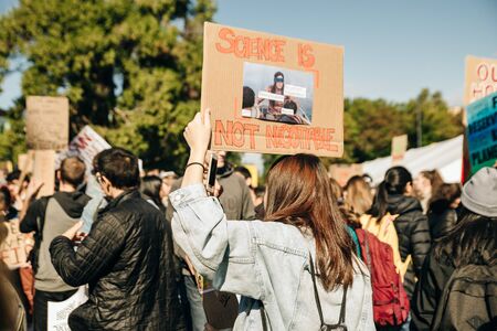 Striking people at rallies on environmental occasion global warming