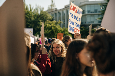 Striking people at rallies on environmental occasion global warming