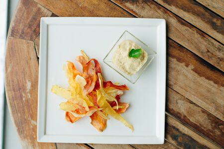hummus with root vegetable color chips