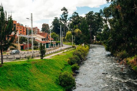Cuenca, Ecuador - February, 2019 View of the river Tomebamba and public park along the river that crosses the center city of Cuencaのeditorial素材