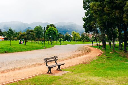 trees and bench in Simon Bolivar Metropolitan public park in the middle of Bogota, Colombia