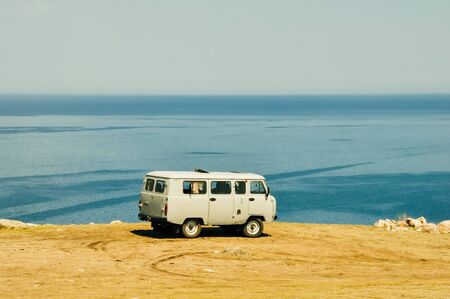 Baikal Lake, Siberia, Russia 2019 Tourist car runing on frozen baikal lake in Russia.