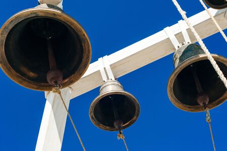 old orthodox copper church bells in the blue sky.の写真素材