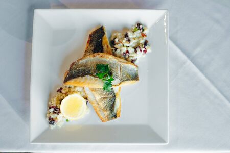 Fish dish - fish fillet and vegetables.の写真素材