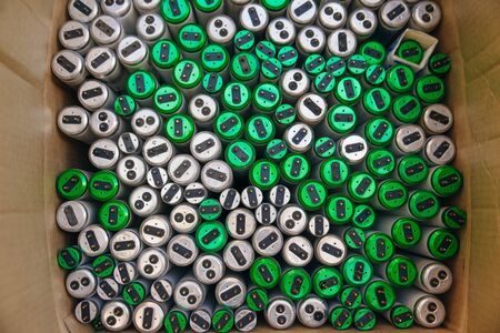Old fluorescent lamps are stacked in rows. Background view.の写真素材