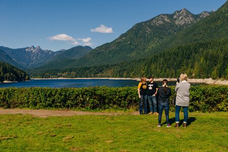 British Columbia, Canada - september, 2019 - Capilano River and the lions mountain with tourists.のeditorial素材