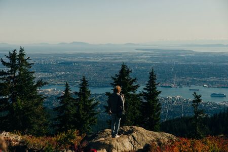 tourists on Grouse Mountain with Downtown city. North Vancouver, BC, Canadaのeditorial素材