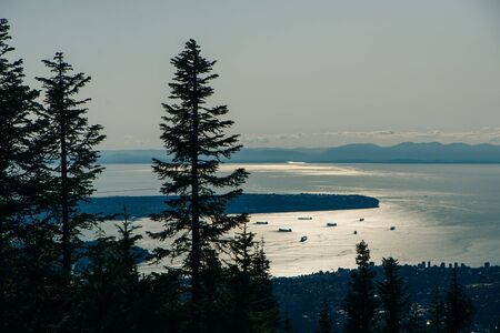 Aerial View of Grouse Mountain with Downtown city. North Vancouver, BC, Canada