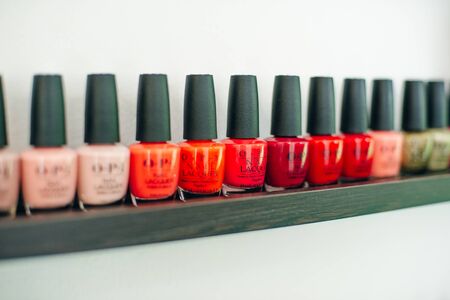 usa, la - january, 2020 colorful nail polish colors in a row at nails saloon on white background.のeditorial素材
