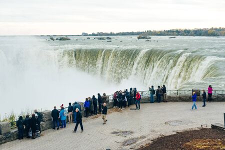 NIAGARA FALLS - CANADA, december 2019 Canadian side of Niagara Falls in autumn. ship with tourists.