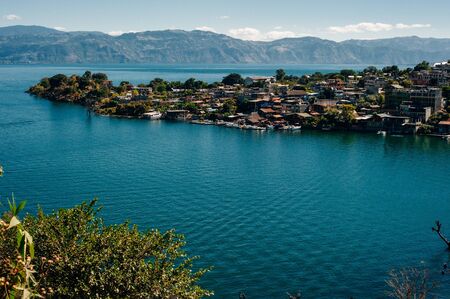 view of San Juan La Laguna on Lake Atitlan on sunriseの写真素材