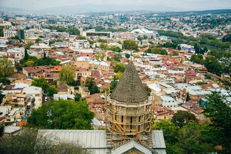 Tbilisi, Georgia - september, 2019 Panoramic view of Tbilisi city from the Narikala Fortress, old town and modern architectureの写真素材