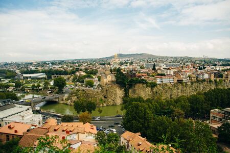 Tbilisi, Georgia - september, 2019 Panoramic view of Tbilisi city from the Narikala Fortress, old town and modern architectureの写真素材