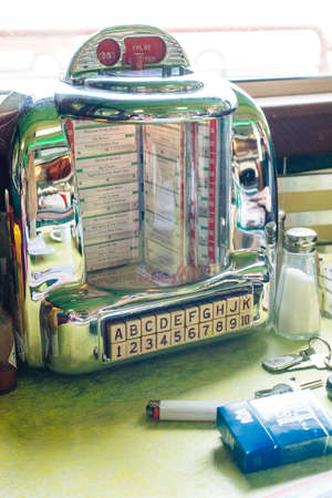 usa, utah - dec, 2019 Antique music playing device in retro style cafe, vintage jukebox, old fashion.のeditorial素材