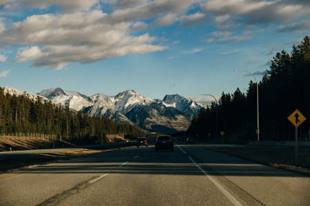Scenic road through the Canadian Rockies, surrounded with rocky mountains. Taken in Banff National Park, Alberta, Canad.のeditorial素材