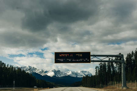 Scenic road through the Canadian Rockies, surrounded with rocky mountains. Taken in Banff National Park, Alberta, Canad.のeditorial素材