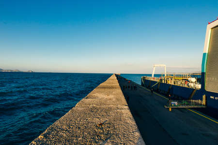 Crete Heraklion Greece port harbor boats panoramic view twilight blue hour travelling.
