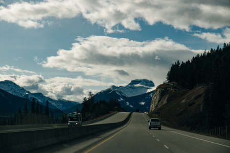 Scenic road through the Canadian Rockies, surrounded with rocky mountains. Taken in Banff National Park, Alberta, Canad.のeditorial素材