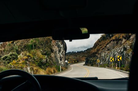 curved road in mountains with cliff.