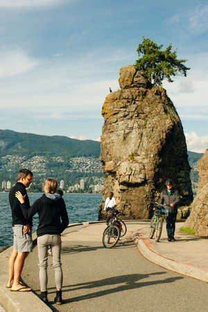 Siwash Rock, a famous rock outcropping in Vancouver, British Columbia, Canada Stanley Park - sep, 2019.のeditorial素材