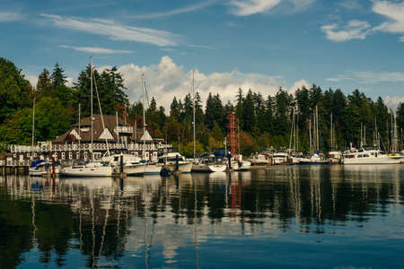 Stunning cityscape view of Vancouver skyline and Burrard Inlet from Stanley Park at sunrise in...