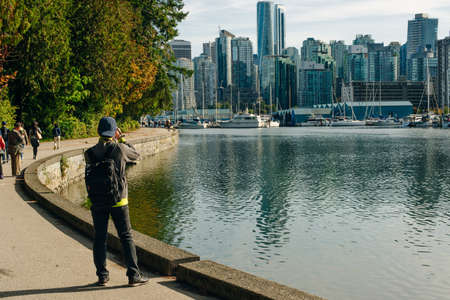 Stunning cityscape view of Vancouver skyline and Burrard Inlet from Stanley Park at sunrise in autumn, Vancouver, British Columbiaのeditorial素材
