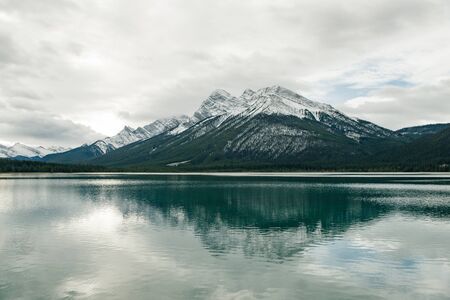 Serene sunrise at the Spray Lakes Reservoir is a reservoir in Alberta, Canadaの写真素材