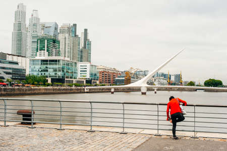 Puerto Madero waterfront day view with Puente de la Mujer, Buenos Aires, Argentina - dec, 2019.のeditorial素材