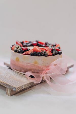 homemade raw strawberry cakes with fresh berries.の写真素材