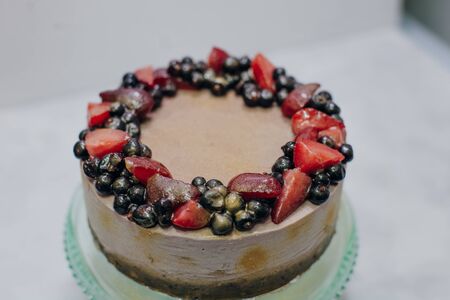 homemade raw strawberry cakes with fresh berries.