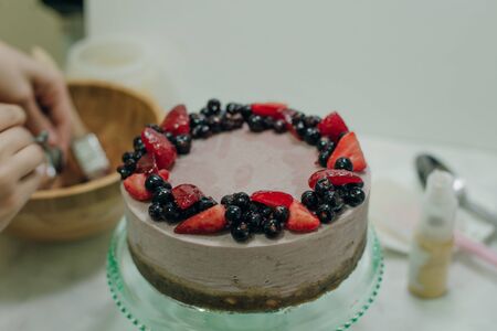 homemade raw strawberry cakes with fresh berries.の写真素材