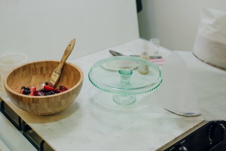 strawberry in gel for a cake on the kitchen.