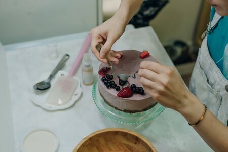 homemade raw strawberry cakes with fresh berries.の写真素材