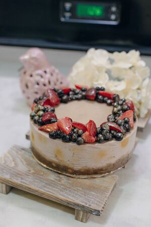 homemade raw strawberry cakes with fresh berries.