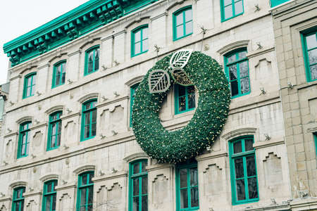 QUEBEC CITY, CANADA - dec, 2019 big Christmas wreath on the house.のeditorial素材