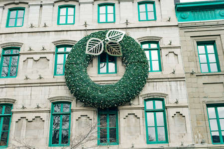 QUEBEC CITY, CANADA - dec, 2019 big Christmas wreath on the house.のeditorial素材