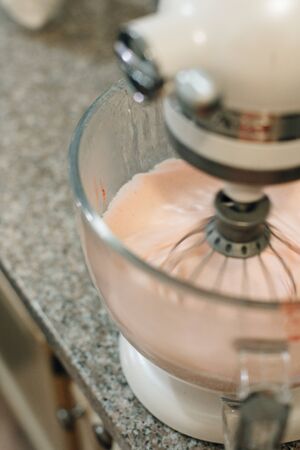 Food processor to kneading dough for zephyr. Manufacturing process of sweet cake.の写真素材