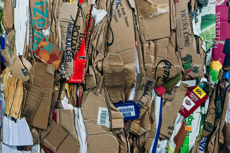 usa, miami - april, 2020 Stack of pressed corrugated cardboards ready for recycling.のeditorial素材