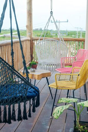 multi-colored wicker chairs on the balcony.の写真素材