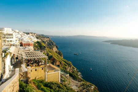 Beautiful view of famous romantic white town in Santorini Island, Greece.の写真素材