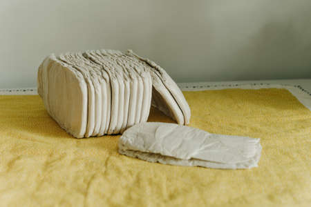 Baby wearing a white reusable diaper. Baby taking care and hygiene concept.の写真素材