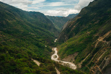 The lost inka city of machu picchu, near cusco.The gray stone inca walls and the green grass in...