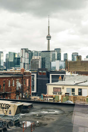 canada, toronto - december, 2019 Evening view from a high-rise building of Toronto Financial District skyscrapers and the CN Tower apex at the backgroundのeditorial素材