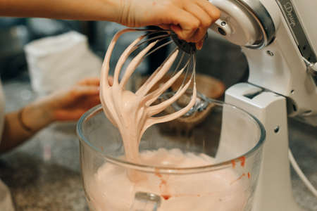 Food processor to kneading dough for zephyr. Manufacturing process of sweet cake.の写真素材