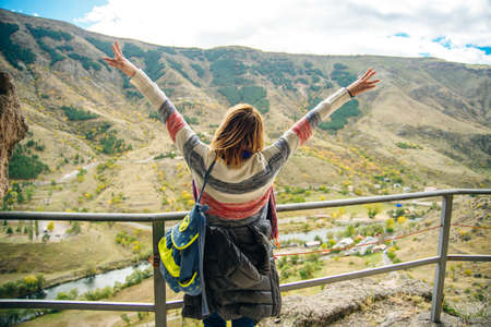 tourist on vardzia, city built in the rock in georgiaの写真素材