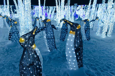 Christmas decoration and luminous garland, and many glowing light bulbs.の写真素材