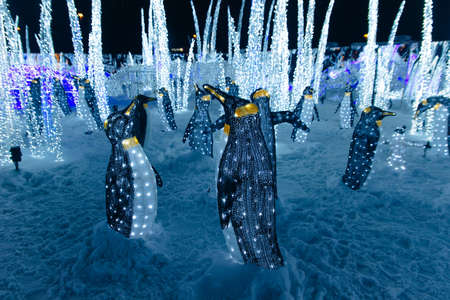 Christmas decoration and luminous garland, and many glowing light bulbs.の写真素材